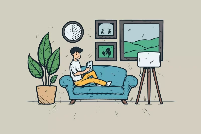 A Man With Playing Smartphone On The Sofa