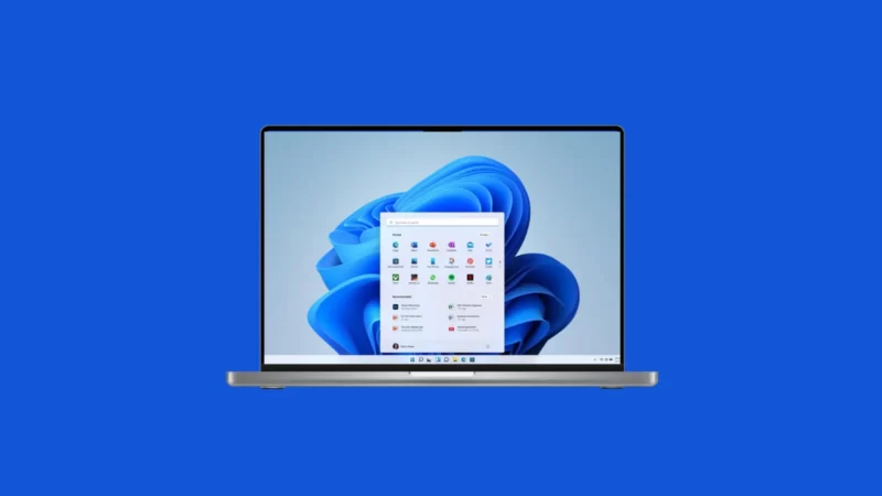 image showing apple laptop with windows 11 homescreen